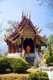 Wat Pa Daet (วัดป่าแดด), the name – ‘sunlit woodland’ – indicates this was formerly a forest temple. A walled enclosure contains a viharn, sala and ho trai or library, while just outside stands an ubosot in traditional northern style, surrounded by a narrow moat.<br/><br/>

The viharn dates from 1877 and was painstakingly restored in the mid-1980s. Decorated in black and gold, the three-tiered roof sweeps low in typical Lan Na style, with elaborate winged gables supporting flaring naga. The steps leading to the portico are guarded by Burmese-style chinthe lions and naga-makara balustrades, with the chinthe emerging from the makara mouths, an unusual synthesis found elsewhere in the Mae Chaem Valley as well as at the ho trai of Wat Phra Singh in Chiang Mai.<br/><br/>

Within the viharn, after passing beneath gilded eyebrow pelmets, are a series of relatively well-preserved late 19th century murals, some of which appear to have been restored, while others are fading almost completely away due perhaps to salinity in the plaster. Of particular interest are panels showing northern Thai women with their long tresses, quite different to Bangkok fashions of the time, and a Buddha birth-scene, northern Thai style, with women crowding around Gautama’s mother as she gives birth standing upright, holding on to the branches of a tree.<br/><br/>

Tucked away in a narrow valley, Mae Chaem (แม่แจ่ม) must rank as one of the least accessible corners of Chiang Mai. Located on the westernmost frontier of the province, it is isolated from the main Chiang Mai valley by the East Thanon Thongchai Range dominated by Doi Inthanon (ดอยอินทนนท์; at 2,565m Thailand’s highest mountain), and from neighbouring Mae Hong Son province to the west by the Central Thanon Thongchai Range, including Doi Khun Bong (ดอยขุนบง; 1,772m).